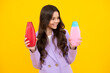 © Olena - Teenager child girl with bottle shampoo conditioners or shower gel. Kids hair care. Hair cosmetic product, shampoo bottle. Happy teenager, positive and smiling emotions of teen girl.