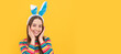 © Olena - she is so cute. childhood happiness. child in rabbit costume. time for fun. kid wearing funny ears. Easter child horizontal poster. Web banner header, copy space.