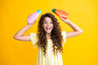 © Olena - Teenage girl with shampoos conditioners or shower gel. Kids hair care cosmetic product, shampoo bottle. Excited teenager, glad amazed and overjoyed emotions.