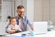 © Pixel-Shot - Young father with his baby and laptop planning budget at home