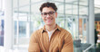 © Flash25/peopleimages.com - Office, happy and portrait of business man with confidence, pride and crossed arms at copywriting agency. Creative, professional and person with glasses for editing career, job opportunity and writer