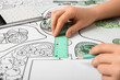 © Pixel-Shot - Female hands with pencil, ruler and calculator on landscape design drawing background