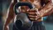 © HansAdam - A muscular man is lifting a heavy kettlebell in a gym setting