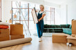© oneinchpunch - Single woman relocating in a new apartment