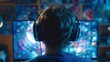 © lisa - Teenager Wearing Headphones Gaming on Monitor in Dark Room