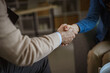 © Miljan Živković - Business partners shaking hands making deal agreement