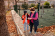 © _KUBE_ - Elderly Caucasian woman strolling with granddaughter during afternoon park visit. Concept of active retirement and family wellbeing.