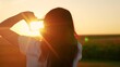 © Victoriia - Hands of young woman director of photography make gesture in frame, sunset park. Everything is like in movie. Seeing world differently. Business planning. Girl shows with her fingers frame symbol, sun