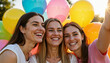 © Silva - Three young women smiling and taking a selfie with balloons outdoors