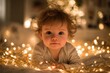© Agung - Adorable Baby Surrounded by Christmas Lights.