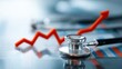 © Ameer - Stethoscope on rising financial chart, healthcare economy and medical finance concept