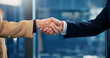 © peopleimages.com - Corporate, people and greeting with handshake in office for meeting, welcome and investment deal. Team, shaking hands and introduction for partnership, agreement and negotiation for financial offer