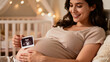© Vera Kokorina - Pregnant woman smiling while holding ultrasound scan in nursery room