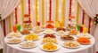 © Vantiya dipakbhai  - Vibrant Indian dessert spread with colorful sweets and drinks in holi festival.