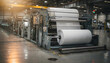 © Oleksandr - Long view of a modern industrial facility showcasing machinery processing large rolls of white material, bathed in warm, natural light from above