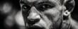 © Ilmi - Intense Focus of a Fighter Preparing for a Match in Mixed Martial Arts with a Determined Expression