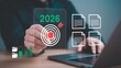 © MD Imran - Businessman interacting with digital marketing target for 2026 on laptop