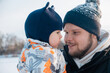 © phpetrunina14 - Father and Child Bonding in Winter Clothing Portrait