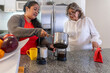 © FABIAN PONCE GARCIA - Women preparing coffee using a french press