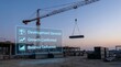 © Mansoor Hassan - Construction site with crane and digital development progress overlay at dusk showcasing growth and balance