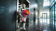 © Lenuccia - Humanoid robot delivering corporate flower bouquet in modern business center - AI powered office gifting and company celebration concept