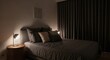 © Prime Assets - Cozy bedroom with dark curtains and soft lighting at night