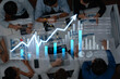 © InfiniteFlow - A diverse group of professionals collaborates on financial charts and data analysis during a business meeting in a modern office environment, showcasing teamwork and insight. Scalp