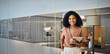 © insta_photos - Happy confident young successful African American business woman lawyer, female advisor, company executive or entrepreneur standing in corporate work office holding digital tablet. Portrait.