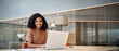 © insta_photos - Portrait of happy young African American business woman employee using laptop computer at work in office. Professional smiling businesswoman executive, company worker manager looking at camera.