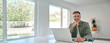 © insta_photos - Happy smiling mature middle aged older professional man wearing eyeglasses looking at camera sitting at living room table, using laptop computer working online at casual home. Portrait.