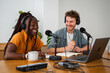 © Nuria Seguí/Stocksy - Colleagues Recording Podcast Together