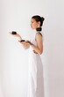 © Tania Cervian/Stocksy - Woman carrying ceramic bowls in hands