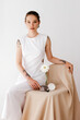 © Tania Cervian/Stocksy - Confident potter in stylish dress exhibiting artwork