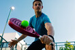 © Adrian Rodd/Stocksy - An expert padel athlete hitting a tennis ball during a match