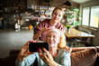 © Geber86 - Young woman and senior woman taking skincare selfie at home