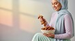 © Banstanks - Woman holding dates in a bowl with copy space ramadan lifestyle concept