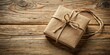 © Collection - Rustic Kraft Paper Gift Box Tied with Twine on Weathered Wooden Surface