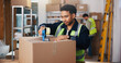 © WesJVR/peopleimages.com - Man, tape and box in warehouse for logistics, delivery service or safe packaging. Male person, distributor or supplier with seal strip on cargo or parcel for courier security or distribution