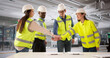 © Andrey Popov - Group Of Workers Collaborating In The Semiconductor Factory