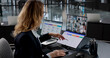 © Andrey Popov - Tech-Savvy Woman Conducing Online Management Webinar