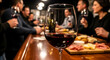 © Phamminn - Elegant close-up of a crystal glass filled with red wine sitting on a rustic wooden bar counter, featuring a blurred background with social people and a savory charcuterie appetizer board.