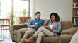 © Luminostock 54 - digital co-founders Concept. Couple relaxing on a couch, using tablet and holding coffee in a cozy living room.