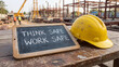 © AiDesign - Workplace construction site health and safety culture awareness campaign with think safe work safe slogan and hard hat representing occupational hazard prevention accident reduction regulatory