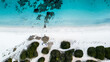 © Andrea Tabaro - Camper van parked on Cala Banana beach, aerial top view, Sardinia, Italy.