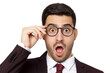 © Damir Khabirov - Young businessman pulling glasses down to reveal shocked expression, close-up portrait