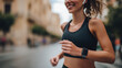 © ink drop - Close up of a woman using a wearable health tracker while running for sports performance and digital biometric data monitoring concepts