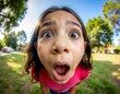 © Michael - Young girl making surprised face with wide angle lens