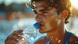 © Vitali - An athlete is hydrating with water while emphasizing crucial recovery and sustained physical performance during intense activity.
