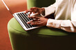 © Artem Podrez/Stocksy - Close-up of hands working on laptop in modern workspace office