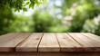 © MonkeyZ - Wooden Table Surface With Green Blurred Nature Background Outdoor Setting